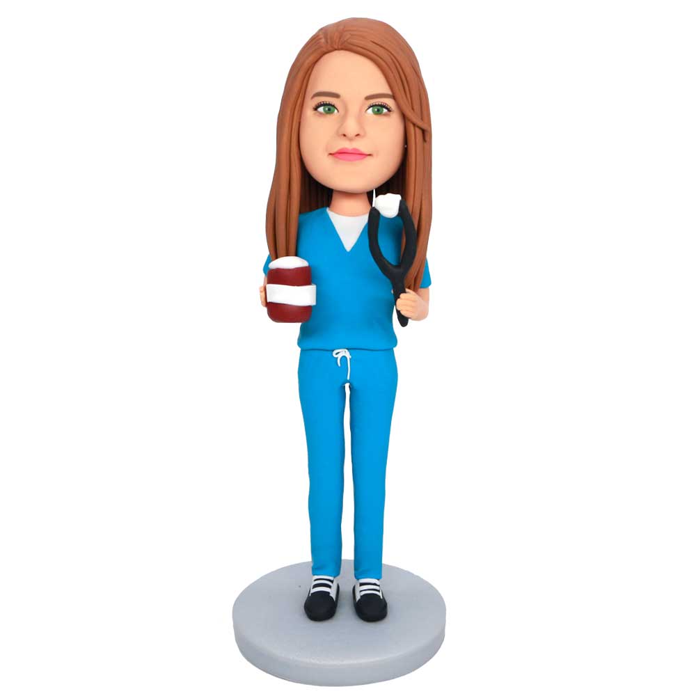 Female Dentist In Blue Uniform Holding Teeth Custom Figure Bobbleheads